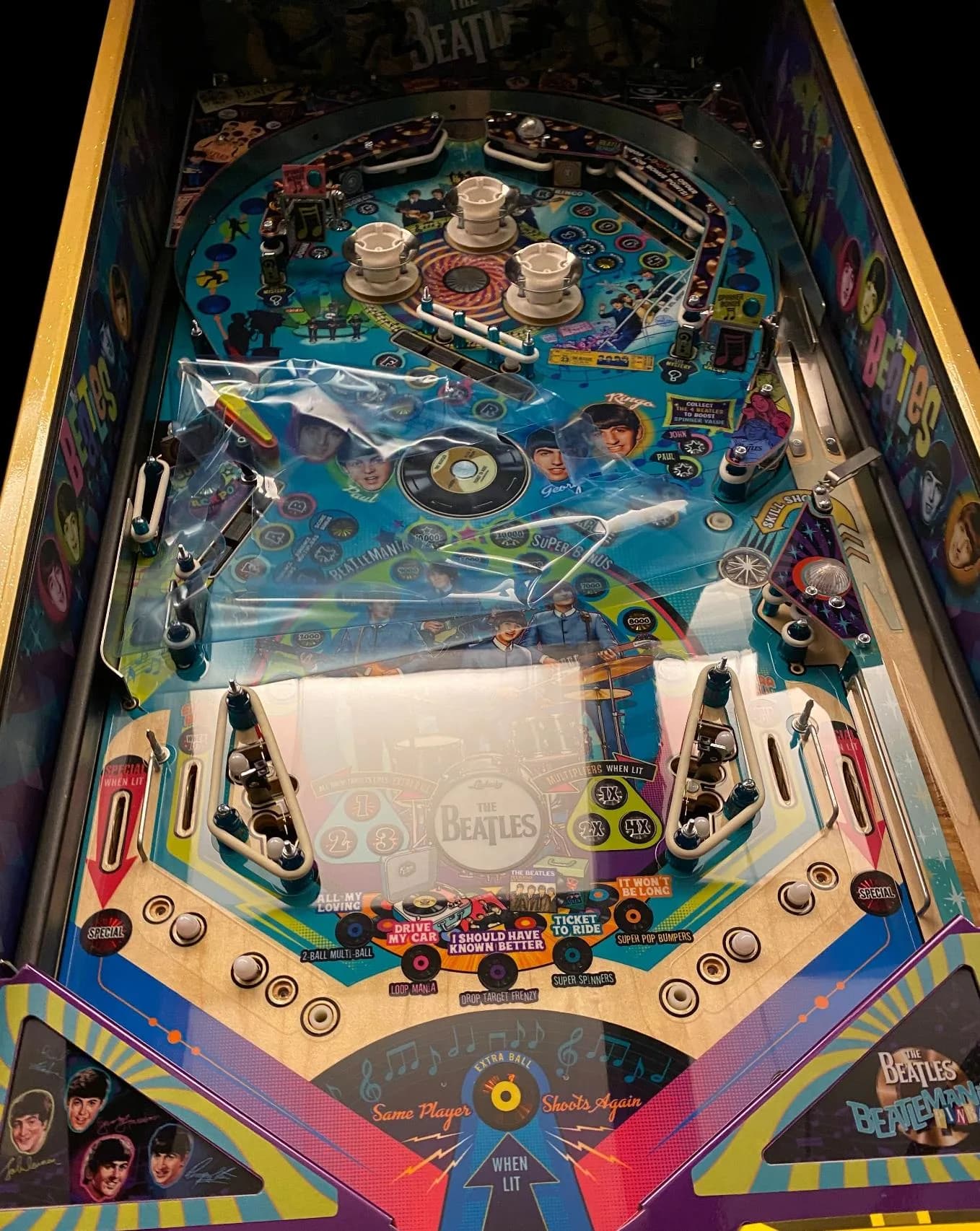 Beatles pinball playfield with the playfield protector installed