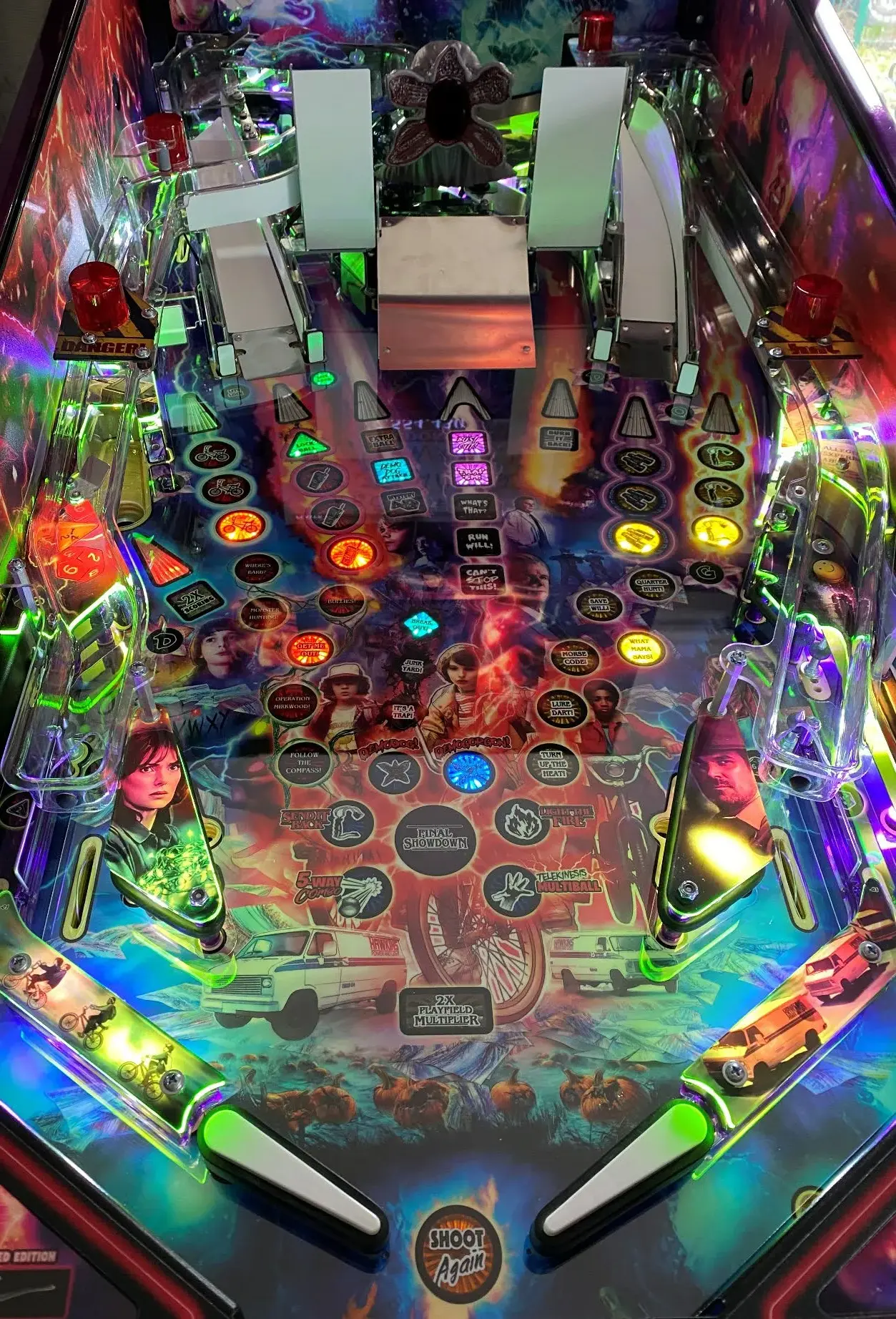 Pinball playfield with a playfield protector installed
