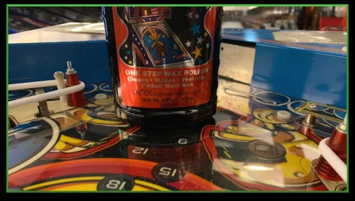 Applying polish to the playfield protector