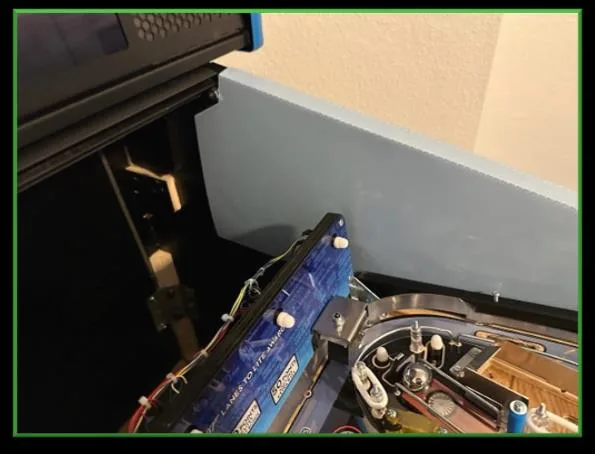 Service protector installed inside a pinball cabinet protecting the mirror blade